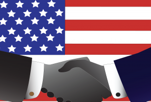 Political Co-operation handshake overlay USA Flag